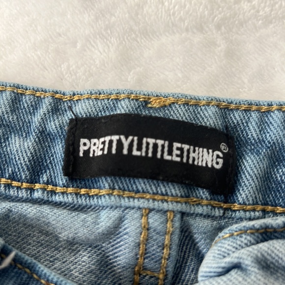 PRETTY LITTLE THING LIGHT BLUE WASH ASYMMETRICAL DENIM JEANS - Picture 5 of 5